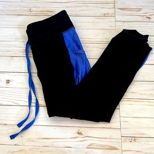 Fabletics Women's Mid-Rise Powerhold Tie Waist 7/8 Legging Blue Black Small